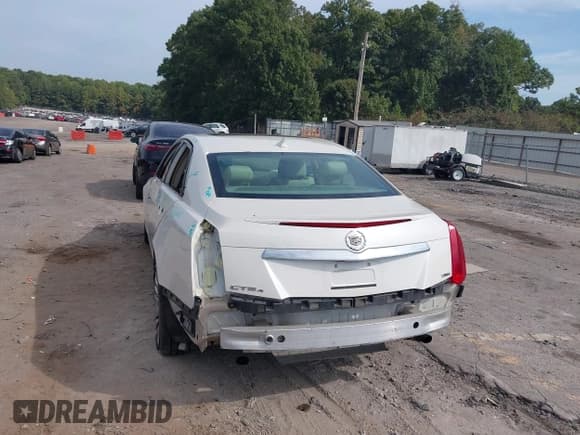 ✅ 2014 Cadillac CTS Luxury AWD • VIN: 1G6AX5S30E0187450 • Lot: 43244469. Listed on IAAI with 103,604 mi. Free auction sales archive from the USA and detailed vehicle history report at DreamBid. Image 3.