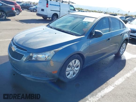✅ 2012 Chevrolet Cruze LS • VIN: 1G1PC5SHXC7271139 • Lot: 41441993. Listed on IAAI with 140,440 mi. Free auction sales archive from the USA and detailed vehicle history report at DreamBid. Image 2.