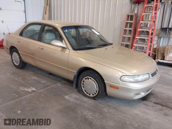 ✅ 1994 Mazda 626 DX • VIN: 1YVGE22C7R5112212 • Лот: 42207980. Опубликован ранее на IAAI с пробегом 128 688 миль. Бесплатный доступ к архиву аукционных продаж из США и подробный отчёт об истории автомобиля на DreamBid. Изображение 1.