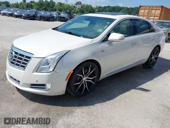 ✅ 2013 Cadillac XTS Premium • VIN: 2G61T5S35D9158316 • Лот: 42785585. Опубликован ранее на IAAI с пробегом 104 347 миль. Бесплатный доступ к архиву аукционных продаж из США и подробный отчёт об истории автомобиля на DreamBid. Изображение 2.