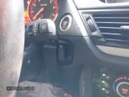 ✅ 2014 BMW X1 xDrive28i • VIN: WBAVL1C50EVY12027 • Lot: 43537124. Listed on IAAI with 84,465 mi. Free auction sales archive from the USA and detailed vehicle history report at DreamBid. Image 11.