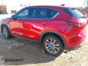 ✅ 2021 Mazda CX-5 Grand Touring • VIN: JM3KFADM9M0300787 • Lot: 41231871. Listed on IAAI with 54,474 mi. Free auction sales archive from the USA and detailed vehicle history report at DreamBid. Image 3.