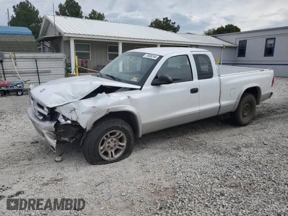 2003 Dodge Dakota SLT with VIN 1D7HL42X93S256342, listed as a Copart auction lot 80322324 with 105,049 mi miles and Salvage title. Bid and sale history available at DreamBid. Image 1.