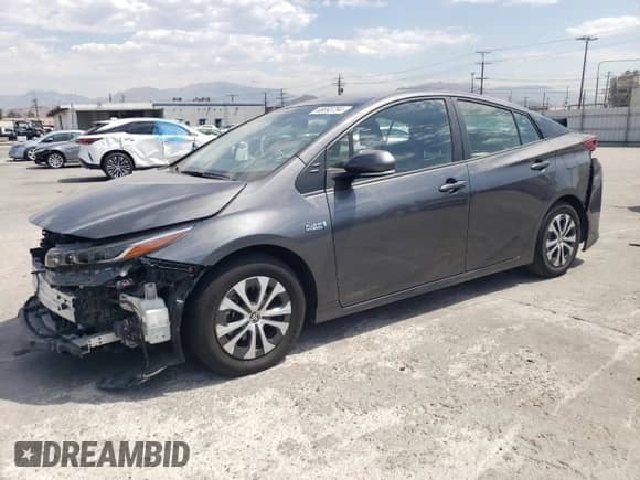 2021 Toyota Prius LE z VIN JTDKAMFP7M3176372, wystawiony jako Copart lot #68893794 z przebiegiem 59 421 mil mil oraz Szkoda całkowita • Salvage title. Historia ofert i sprzedaży dostępna na DreamBid. Obrazek 1.