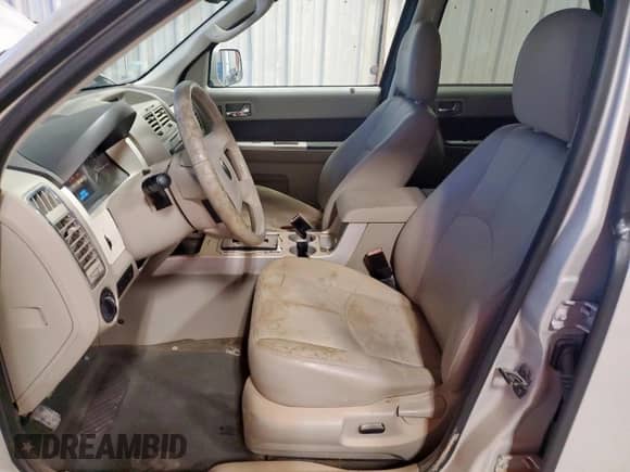 2009 Mercury Mariner Premier с VIN 4M2CU87769KJ12378, выставлен на аукционе Copart как лот 69630725 с пробегом 67 949 миль миль и На запчасти • Non repairable. История ставок и продаж доступна на DreamBid. Изображение 7.