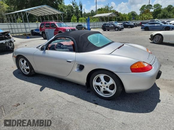 ✅ 1997 Porsche Boxster • VIN: WP0CA2983VS624787 • Lot: 64928985. Listed on Copart with 70,369 mi. Free auction sales archive from the USA and detailed vehicle history report at DreamBid. Image 2.
