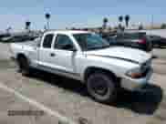 2003 Dodge Dakota SLT with VIN 1D7HL42XX3S236052, listed as a Copart auction lot 61485585 with 424,339 mi miles and Salvage title. Bid and sale history available at DreamBid. Image 4.