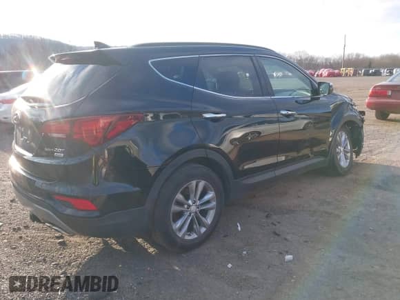 2017 Hyundai Santa Fe 2.0T z VIN 5XYZUDLA8HG502333, wystawiony jako IAAI lot #41246195 z przebiegiem 62 772 mil mil oraz . Historia ofert i sprzedaży dostępna na DreamBid. Obrazek 4.