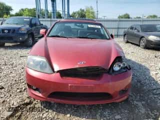 2006 Hyundai Tiburon GT с VIN KMHHN65FX6U190598, выставлен на аукционе Copart как лот 61143675 с пробегом Не указан миль и Списание • Salvage title. История ставок и продаж доступна на DreamBid. Изображение 5.