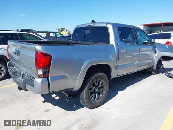 ✅ 2023 Toyota Tacoma SR • VIN: 3TMCZ5AN9PM589986 • Lot: 39071998. Listed on IAAI with 31,945 mi. Free auction sales archive from the USA and detailed vehicle history report at DreamBid. Image 4.