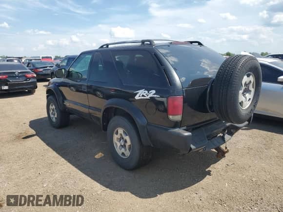 2005 Chevrolet Blazer LS with VIN 1GNCT18X45K101945, listed as a Copart auction lot 62762255 with 160,212 mi miles and Salvage title. Bid and sale history available at DreamBid. Image 2.
