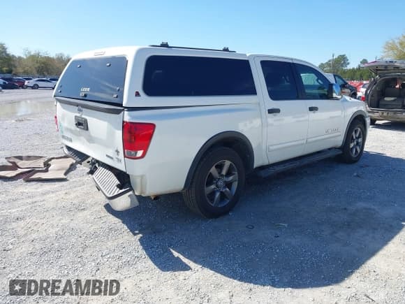 ✅ 2015 Nissan Titan SV • VIN: 1N6BA0ED5FN503033 • Lot: 41881909. Listed on IAAI with 151,432 mi. Free auction sales archive from the USA and detailed vehicle history report at DreamBid. Image 4.