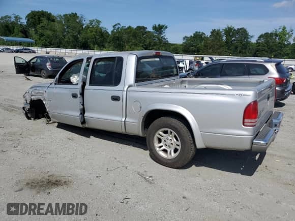 2003 Dodge Dakota SLT z VIN 1D7HL48XX3S197440, wystawiony jako Copart lot #61722005 z przebiegiem 167 398 mil mil oraz Czysty tytuł • Clean title. Historia ofert i sprzedaży dostępna na DreamBid. Obrazek 2.