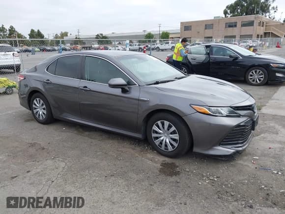 ✅ 2020 Toyota Camry Hybrid LE • VIN: 4T1C31AK4LU518924 • Lot: 43100533. Listed on IAAI with 137,023 mi. Free auction sales archive from the USA and detailed vehicle history report at DreamBid. Image 1.