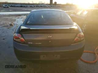 2008 Hyundai Tiburon GS z VIN KMHHM66D18U274943, wystawiony jako Copart lot #89398555 z przebiegiem 196 250 mil mil oraz Szkoda całkowita • Salvage title. Historia ofert i sprzedaży dostępna na DreamBid. Obrazek 6.
