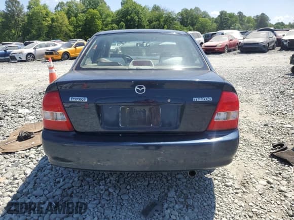 ✅ 1999 Mazda Protege DX • VIN: JM1BJ2229X0137724 • Lot: 55149115. Wystawiony na Copart z przebiegiem 173 108 mil. Bezpłatny archiwum sprzedaży aukcyjnych z USA i szczegółowy raport historii pojazdu na DreamBid. Zdjęcie 6.