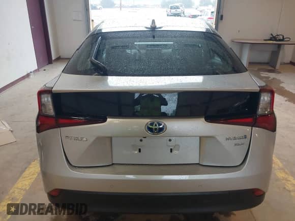 2021 Toyota Prius L Eco with VIN JTDKAMFU4M3147210, listed as a IAAI auction lot 42437023 with 12,673 mi miles and . Bid and sale history available at DreamBid. Image 16.