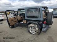 ✅ 2002 Jeep Wrangler Sahara • VIN: 1J4FA59S12P761276 • Lot: 90629975. Listed on Copart with 160,977 mi. Free auction sales archive from the USA and detailed vehicle history report at DreamBid. Image 2.