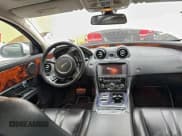 ✅ 2013 Jaguar XJ • VIN: SAJWJ1CD7D8V49599 • Lot: 96119395. Listed on Copart with 133,163 mi. Free auction sales archive from the USA and detailed vehicle history report at DreamBid. Image 9.