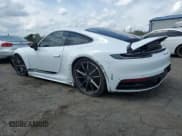 ✅ 2024 Porsche 911 Carrera • VIN: WP0AA2A98RS210079 • Лот: 65351655. Опубликован ранее на Copart с пробегом 6 153 миль. Бесплатный доступ к архиву аукционных продаж из США и подробный отчёт об истории автомобиля на DreamBid. Изображение 2.