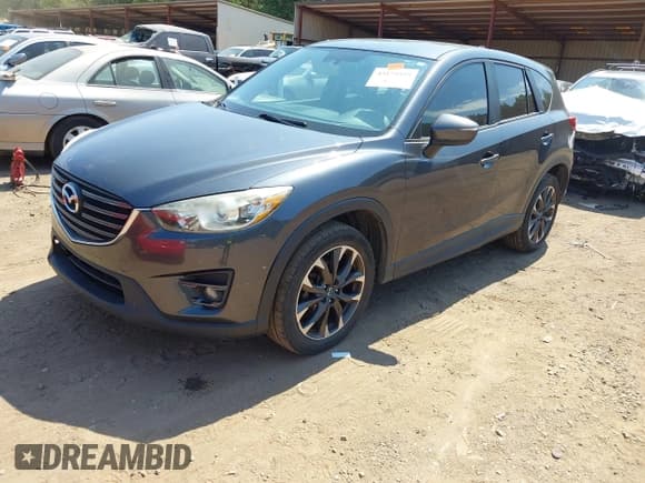 ✅ 2016 Mazda CX-5 Grand Touring • VIN: JM3KE2DYXG0769581 • Lot: 43174558. Listed on IAAI with 206,517 mi. Free auction sales archive from the USA and detailed vehicle history report at DreamBid. Image 17.