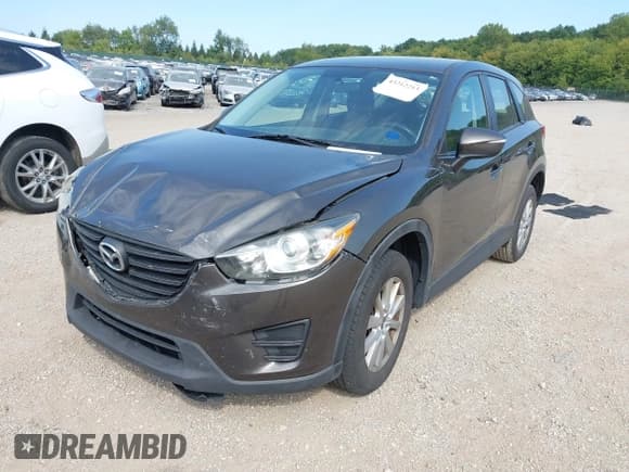✅ 2016 Mazda CX-5 Sport • VIN: JM3KE4BY5G0610675 • Lot: 43212213. Listed on IAAI with 234,292 mi. Free auction sales archive from the USA and detailed vehicle history report at DreamBid. Image 2.