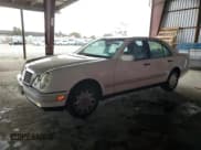 ✅ 1997 Mercedes-Benz E 320 • VIN: WDBJF55F0VA401089 • Lot: 83848065. Listed on Copart with 173,615 mi. Free auction sales archive from the USA and detailed vehicle history report at DreamBid. Image 1.