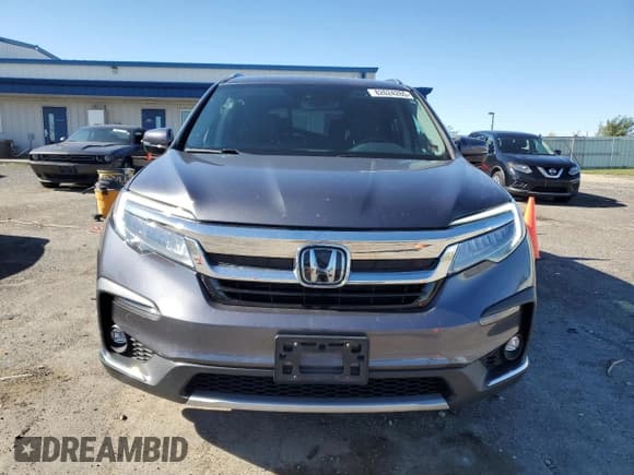 ✅ 2020 Honda Pilot Touring 7-Passenger • VIN: 5FNYF6H67LB028560 • Lot: 82624265. Wystawiony na Copart z przebiegiem 73 131 mil. Bezpłatny archiwum sprzedaży aukcyjnych z USA i szczegółowy raport historii pojazdu na DreamBid. Zdjęcie 5.