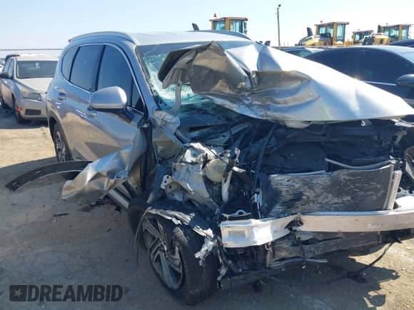 2021 Hyundai Santa Fe SEL z VIN 5NMS24AJ7MH307785, wystawiony jako IAAI lot #43155163 z przebiegiem 69 928 mil mil oraz . Historia ofert i sprzedaży dostępna na DreamBid. Obrazek 1.