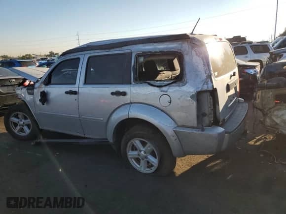 2007 Dodge Nitro SXT z VIN 1D8GU28K67W729293, wystawiony jako Copart lot #74600814 z przebiegiem Nie podano mil oraz Szkoda całkowita • Salvage title. Historia ofert i sprzedaży dostępna na DreamBid. Obrazek 2.