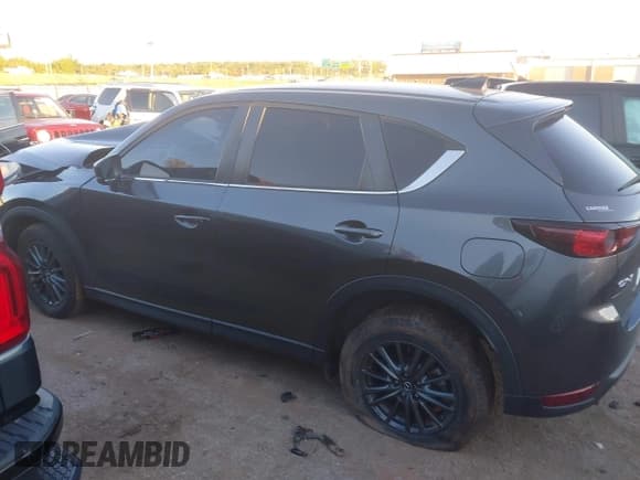✅ 2021 Mazda CX-5 Carbon Edition • VIN: JM3KFACM9M0479446 • Lot: 43562414. Listed on IAAI with 27,622 mi. Free auction sales archive from the USA and detailed vehicle history report at DreamBid. Image 14.
