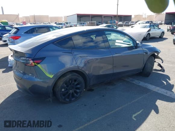 ✅ 2023 Tesla Model Y Long Range • VIN: 7SAYGAEE4PF945847 • Lot: 41071924. Listed on IAAI with 33,454 mi. Free auction sales archive from the USA and detailed vehicle history report at DreamBid. Image 4.