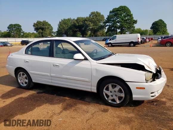 2004 Hyundai Elantra GLS with VIN KMHDN46D24U728241, listed as a Copart auction lot 68002955 with 242,945 mi miles and Salvage title. Bid and sale history available at DreamBid. Image 4.