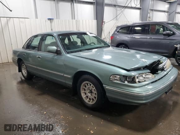 ✅ 1997 Ford Crown Victoria LX • VIN: 2FALP74W8VX231100 • Lot: 46806545. Listed on Copart with 156,739 mi. Free auction sales archive from the USA and detailed vehicle history report at DreamBid. Image 4.