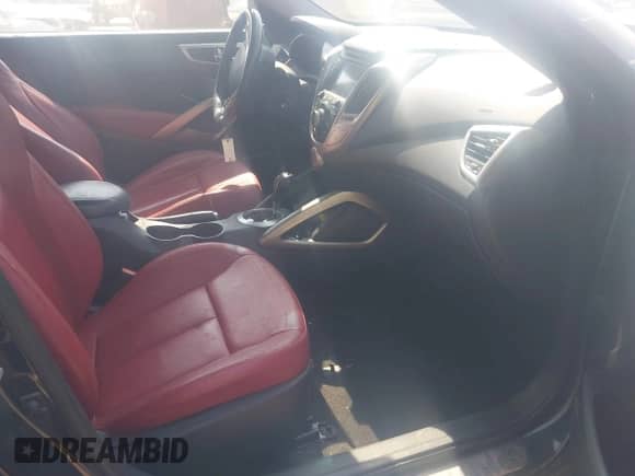 2014 Hyundai Veloster with VIN KMHTC6AD2EU214301, listed as a IAAI auction lot 43016517 with 122,845 mi miles and . Bid and sale history available at DreamBid. Image 5.