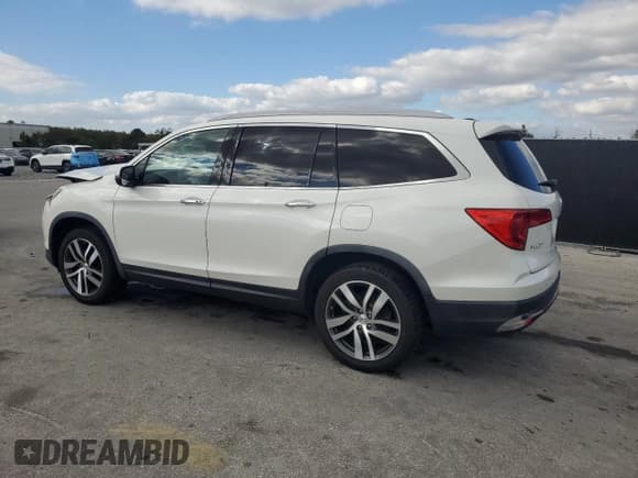 ✅ 2017 Honda Pilot Touring • VIN: 5FNYF6H97HB050401 • Lot: 91220765. Wystawiony na Copart z przebiegiem 121 016 mil. Bezpłatny archiwum sprzedaży aukcyjnych z USA i szczegółowy raport historii pojazdu na DreamBid. Zdjęcie 2.