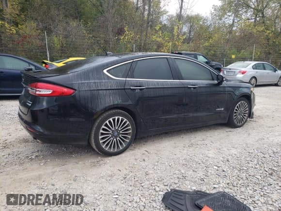 ✅ 2017 Ford Fusion Hybrid Titanium • VIN: 3FA6P0RU7HR278472 • Lot: 82434245. Wystawiony na Copart z przebiegiem 144 287 mil. Bezpłatny archiwum sprzedaży aukcyjnych z USA i szczegółowy raport historii pojazdu na DreamBid. Zdjęcie 3.
