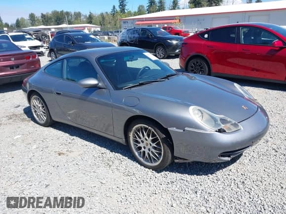 ✅ 2001 Porsche 911 Carrera 997 • VIN: WP0AA29911S620165 • Lot: 42979235. Wystawiony na IAAI z przebiegiem 127 920 mil. Bezpłatny archiwum sprzedaży aukcyjnych z USA i szczegółowy raport historii pojazdu na DreamBid. Zdjęcie 1.