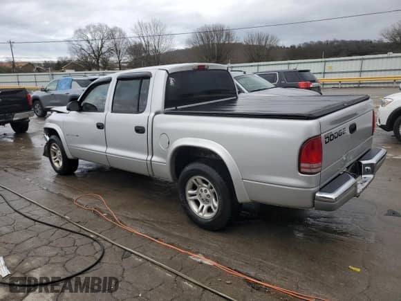 2002 Dodge Dakota SLT z VIN 1B7HL48X72S584617, wystawiony jako Copart lot #86504284 z przebiegiem 236 216 mil mil oraz Szkoda całkowita • Salvage title. Historia ofert i sprzedaży dostępna na DreamBid. Obrazek 2.
