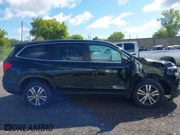 ✅ 2017 Honda Pilot EX-L • VIN: 5FNYF6H59HB091514 • Lot: 43083784. Listed on IAAI with 97,606 mi. Free auction sales archive from the USA and detailed vehicle history report at DreamBid. Image 14.