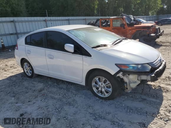 ✅ 2010 Honda Insight EX • VIN: JHMZE2H77AS035113 • Lot: 54179005. Listed on Copart with 165,083 mi. Free auction sales archive from the USA and detailed vehicle history report at DreamBid. Image 4.
