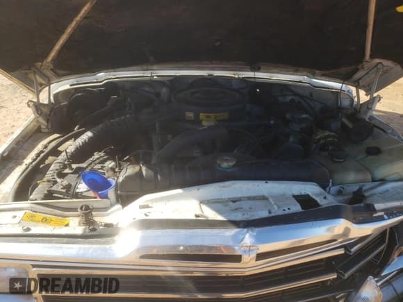 ✅ 1988 Jeep Grand Wagoneer • VIN: 1JCNJ15U9JT105185 • Lot: 89126005. Wystawiony na Copart z przebiegiem 116 630 mil. Bezpłatny archiwum sprzedaży aukcyjnych z USA i szczegółowy raport historii pojazdu na DreamBid. Zdjęcie 12.