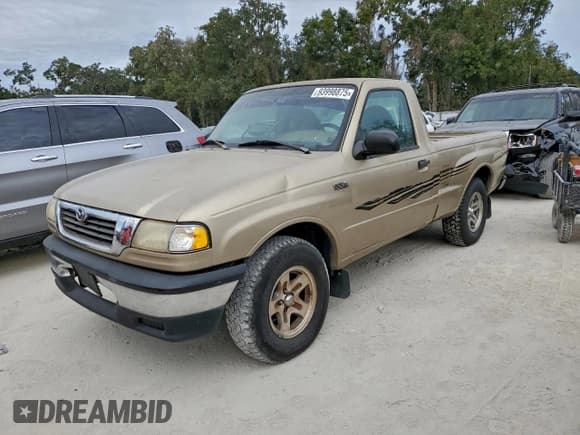 ✅ 1999 Mazda B-Series SX • VIN: 4F4YR12C7XTM22336 • Lot: 93998875. Listed on Copart with 304,120 mi. Free auction sales archive from the USA and detailed vehicle history report at DreamBid. Image 1.