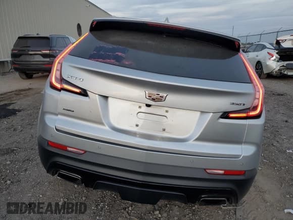✅ 2021 Cadillac XT4 AWD Sport • VIN: 1GYFZFR46MF043456 • Лот: 83324124. Опубликован ранее на Copart с пробегом 59 785 миль. Бесплатный доступ к архиву аукционных продаж из США и подробный отчёт об истории автомобиля на DreamBid. Изображение 6.
