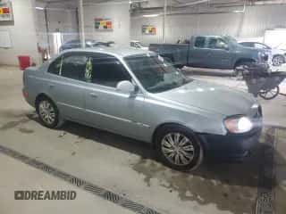 2005 Hyundai Accent GLS z VIN KMHCG45C65U662633, wystawiony jako Copart lot #86432595 z przebiegiem 221 608 mil mil oraz Szkoda całkowita • Salvage title. Historia ofert i sprzedaży dostępna na DreamBid. Obrazek 4.