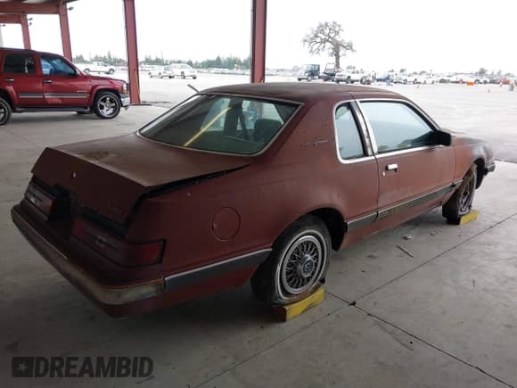 ✅ 1984 Ford Thunderbird • VIN: 1FABP4630EA111572 • Lot: 41569309. Listed on IAAI with 7,919 mi. Free auction sales archive from the USA and detailed vehicle history report at DreamBid. Image 4.