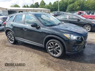 ✅ 2016 Mazda CX-5 Grand Touring • VIN: JM3KE2DY3G0727737 • Lot: 42922867. Wystawiony na IAAI z przebiegiem 71 475 mil. Bezpłatny archiwum sprzedaży aukcyjnych z USA i szczegółowy raport historii pojazdu na DreamBid. Zdjęcie 1.