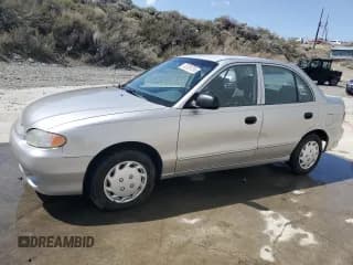 ✅ 1998 Hyundai Accent GL • VIN: KMHVF24N8WU500040 • Лот: 52039755. Опубликован ранее на Copart с пробегом 103 631 миль. Бесплатный доступ к архиву аукционных продаж из США и подробный отчёт об истории автомобиля на DreamBid. Изображение 1.