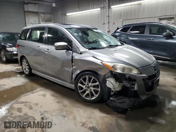 ✅ 2012 Mazda 5 Grand Touring • VIN: JM1CW2DL5C0143414 • Lot: 92329075. Listed on Copart with 107,084 mi. Free auction sales archive from the USA and detailed vehicle history report at DreamBid. Image 4.