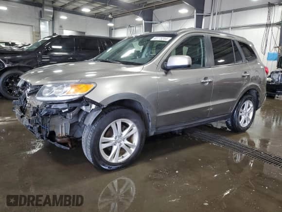 2012 Hyundai Santa Fe Limited с VIN 5XYZKDAGXCG152385, выставлен на аукционе Copart как лот 63775244 с пробегом 149 243 миль миль и Списание • Salvage title. История ставок и продаж доступна на DreamBid. Изображение 1.